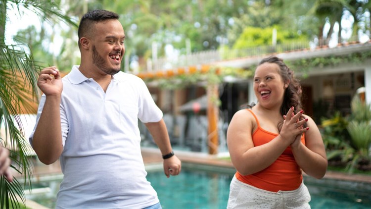 two people with disability dancing and having fun